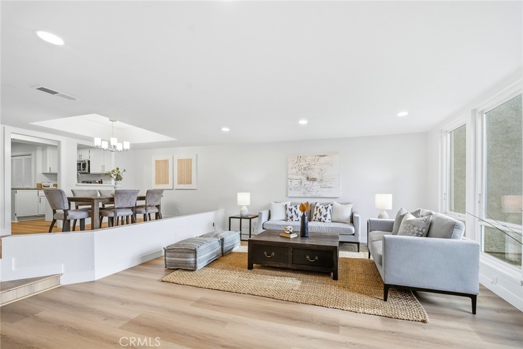 Wide view of the living room and dining area. - 25911 Blascos 102, Mission Viejo CA 92691 - photo 9