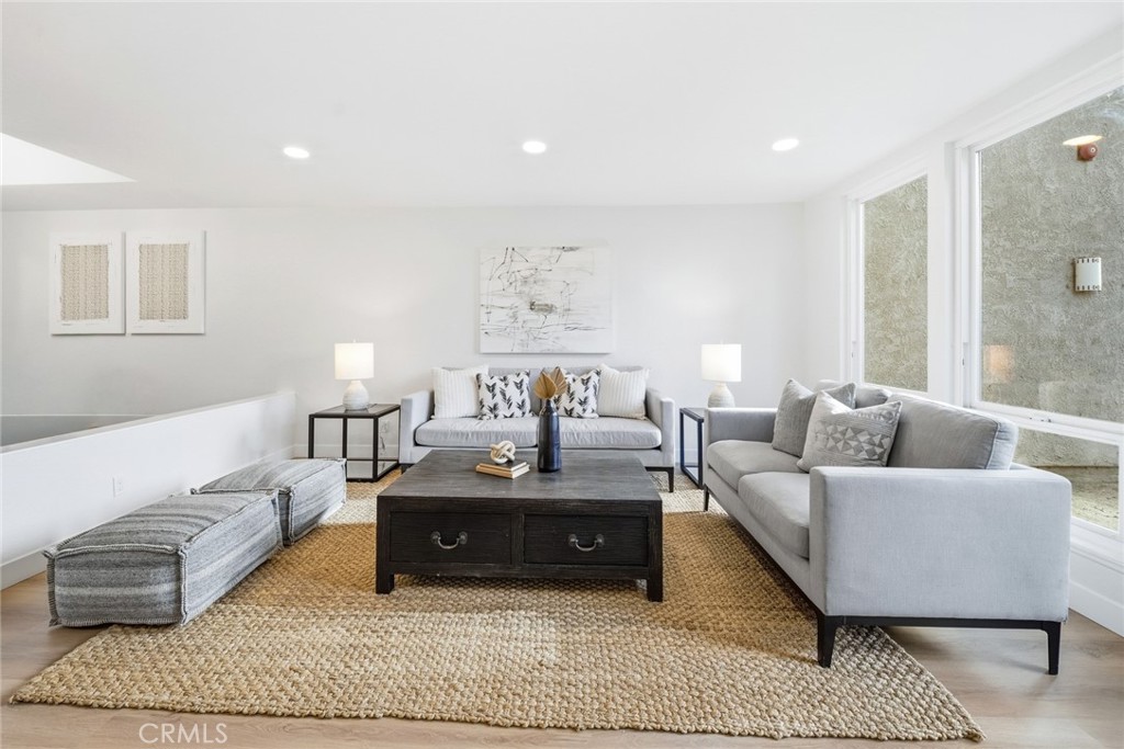 Living room seating area with natural light. - 25911 Blascos 102, Mission Viejo CA 92691 - photo 10