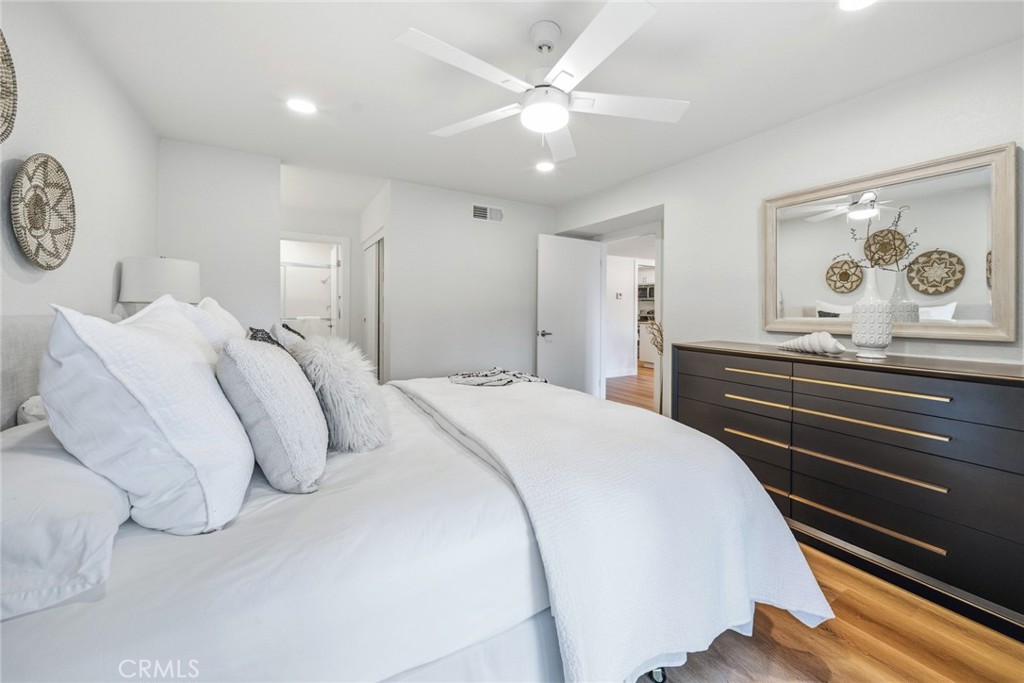 Bedroom with dresser and mirror, view toward the entry. - 25911 Blascos 102, Mission Viejo CA 92691 - photo 20