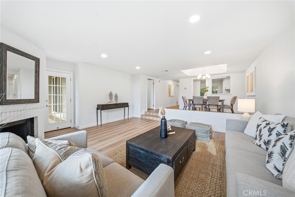 Living room, wide view toward the dining area. - 25911 Blascos 102, Mission Viejo CA 92691 - photo 32