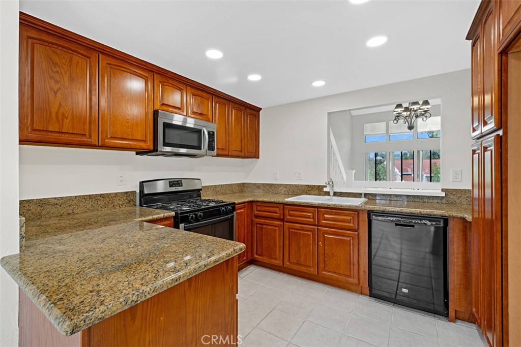 kitchen with newer cabinets granite counters - 25915 Orbita, Mission Viejo CA 92691 - photo 11