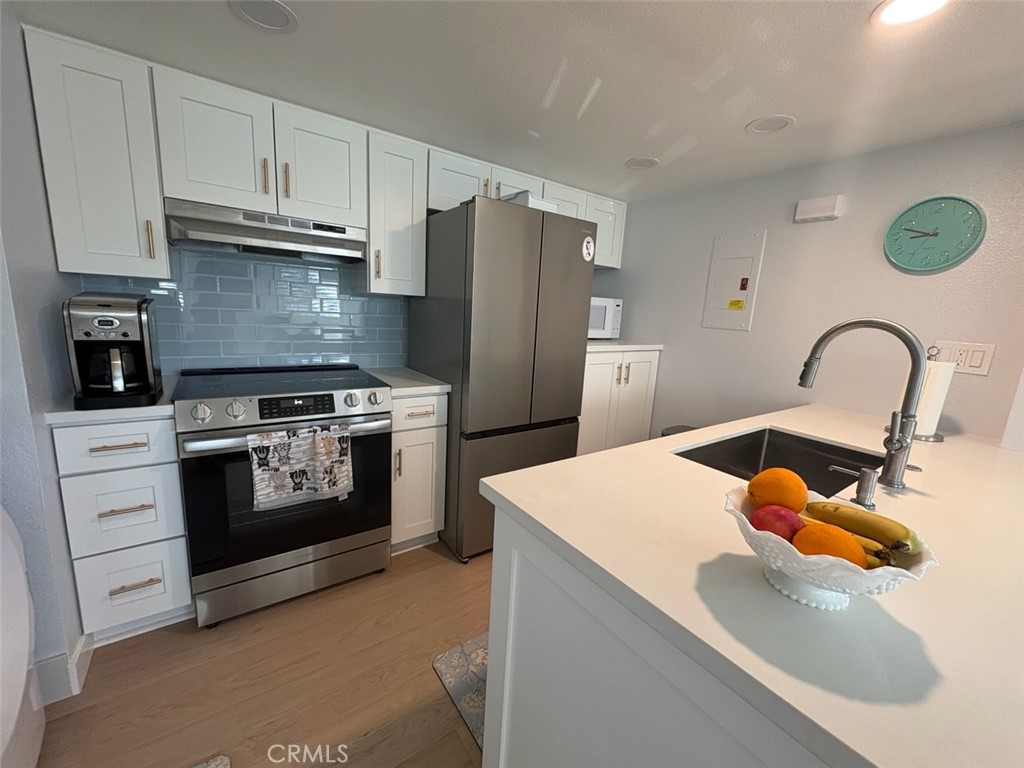 Kitchen with appliances - 26121 La Real # 6F, Mission Viejo CA 92691 - photo 8
