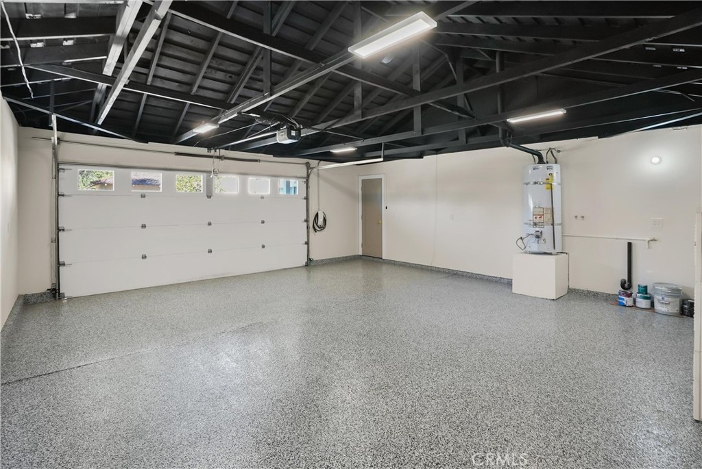 Garage with epoxy flooring and EV charger - 26201 San Roque Drive, Mission Viejo CA 92691 - photo 37