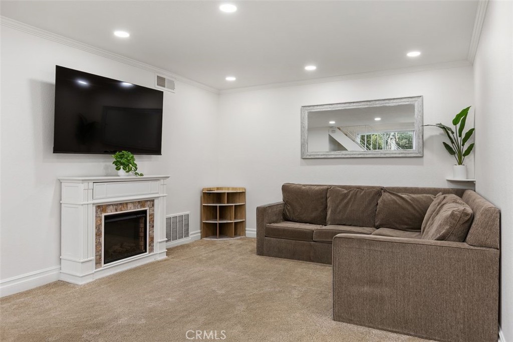 Living Room-freestanding electric fireplace is included. - 26495 Via Damasco, Mission Viejo CA 92691 - photo 4