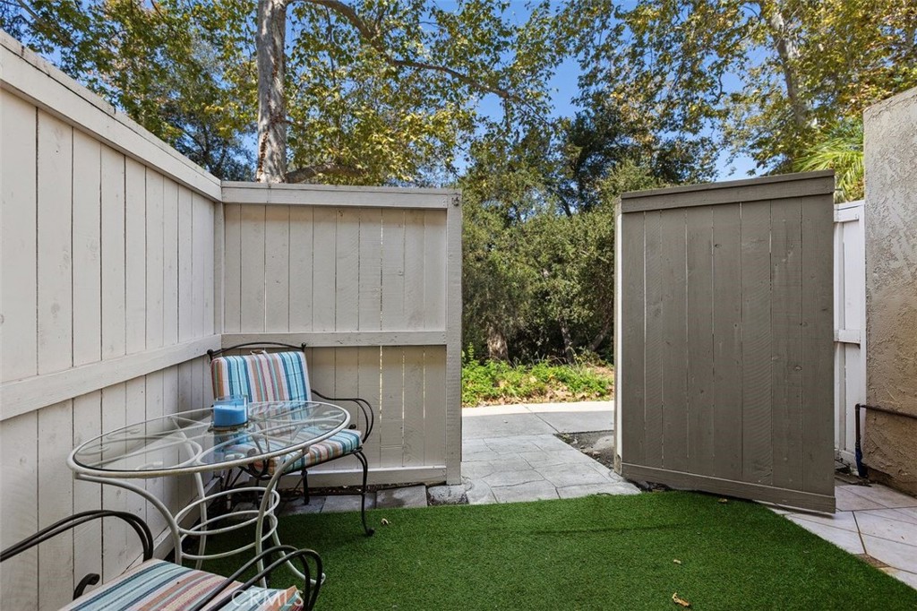 Private Patio opens to wooded area across the community walk way - 26495 Via Damasco, Mission Viejo CA 92691 - photo 11