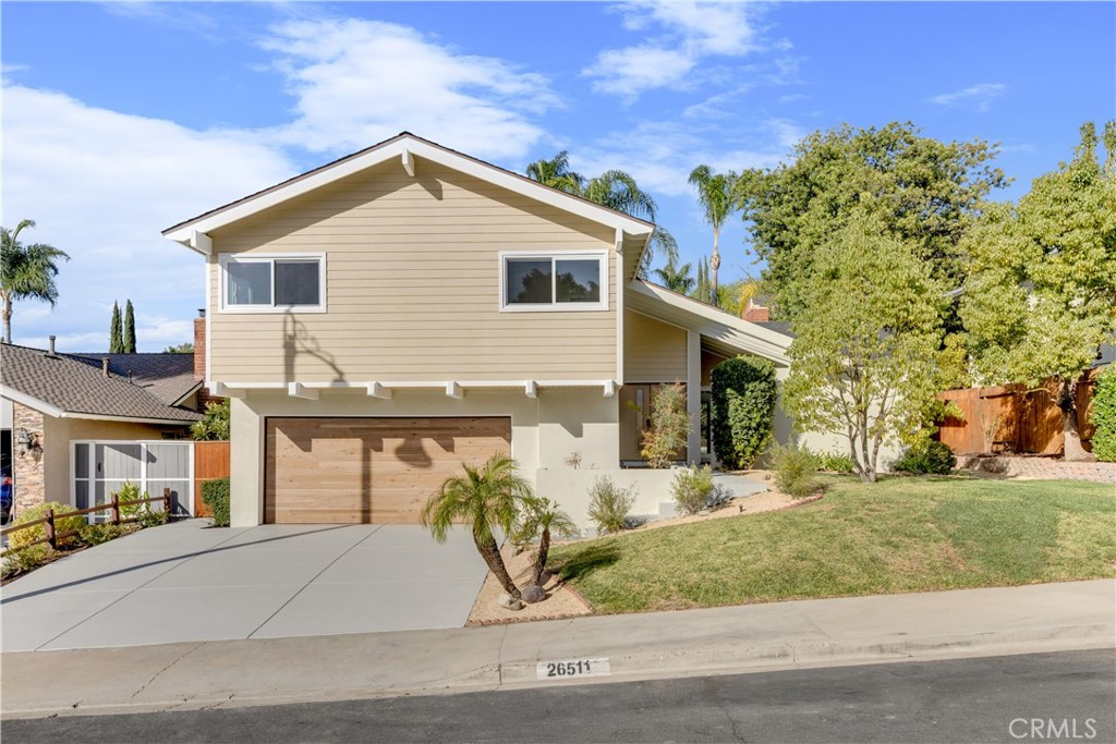 Front view of the property showcasing the modern design, well-maintained exterior, and landscaped yard. - 26511 Granvia, Mission Viejo CA 92691 - photo 1