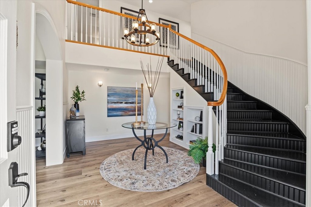The elevated ceiling height and sweeping curved staircase at the Entry Foyer makes a lasting initial impression of unden - 26515 Via Del Sol, Mission Viejo CA 92691 - photo 5