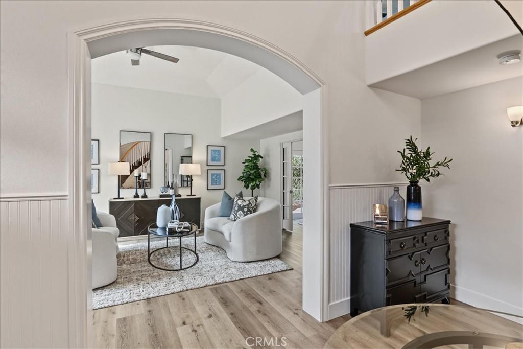 The welcoming archway of the Front Living Space will beckon you to enter, and the casual lighting with ceiling fan will - 26515 Via Del Sol, Mission Viejo CA 92691 - photo 6