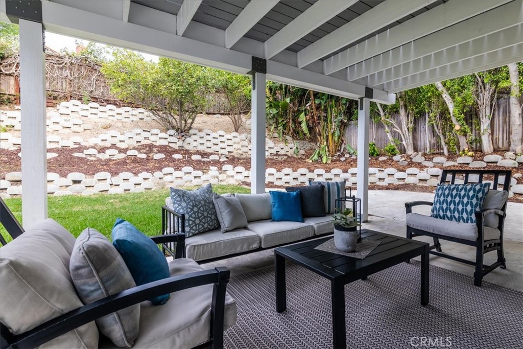 This shaded patio makes for a very comfortable outdoor gathering space! - 26515 Via Del Sol, Mission Viejo CA 92691 - photo 19
