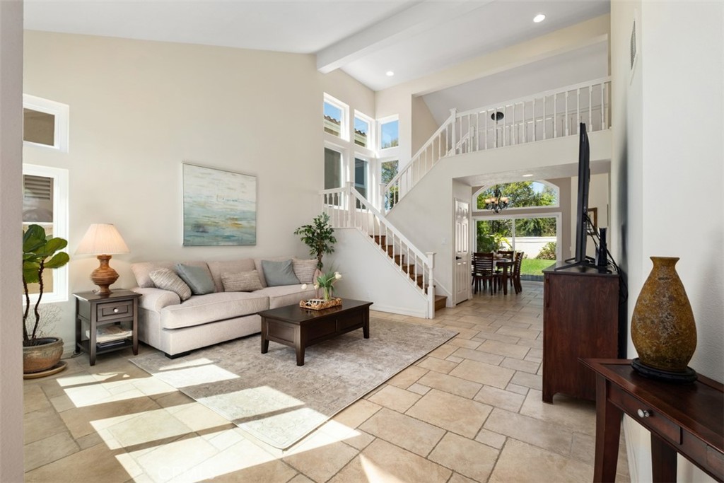 bright livingroom with cathedral ceilings - 26535 Mikanos, Mission Viejo CA 92692 - photo 2