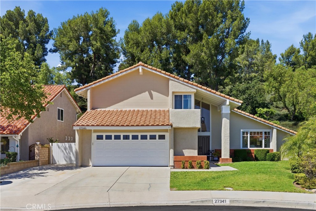 Spacious two-story single-family home located on a quiet cul-de-sac with a large driveway, attached two-car garage, and - 27341 Becedas, Mission Viejo CA 92691 - photo 1