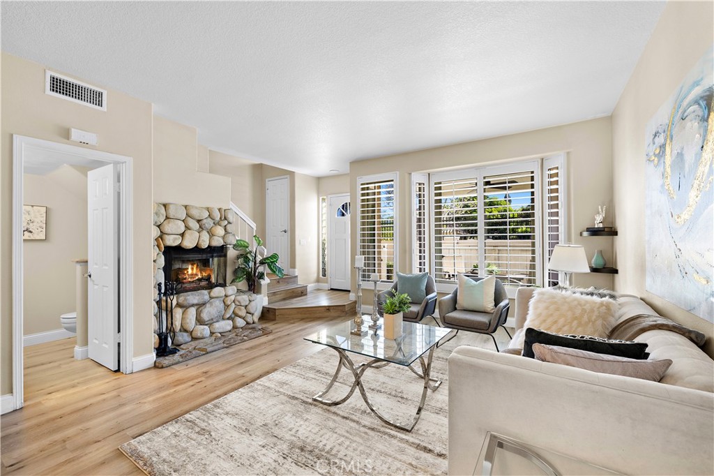 Living room with custom stone fireplace - 27474 Lilac, Mission Viejo CA 92692 - photo 8
