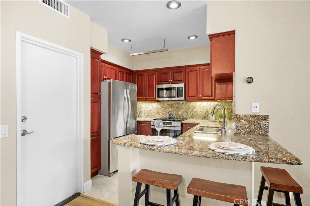 Breakfast Bar seating near the kitchen - 27474 Lilac, Mission Viejo CA 92692 - photo 12