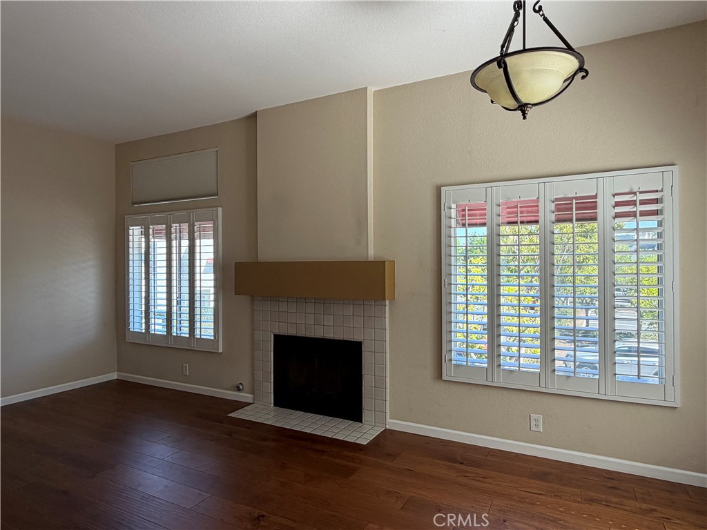 Bright living room featuring classic plantation shutters and natural light. - 27853 Ruby, Mission Viejo CA 92691 - photo 4