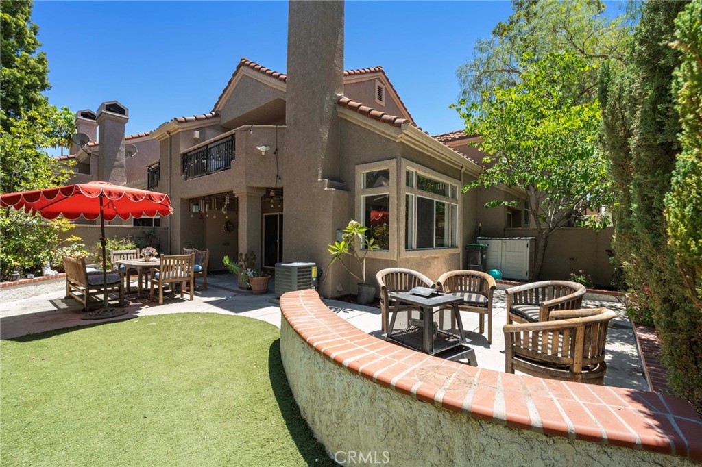 Amazing wrap around backyard with covered patio area, eating area, turf area and firepit area - 27911 Freeport, Mission Viejo CA 92692 - photo 1