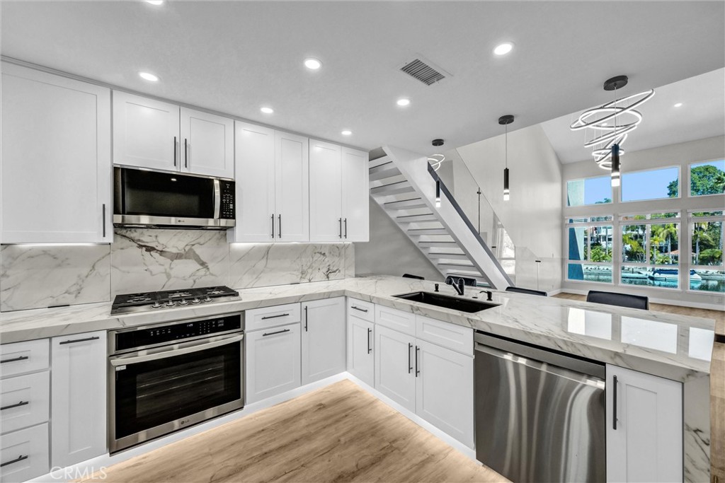 Beautifully remodeled kitchen with quartz counters - 27931 Trocadero, Mission Viejo CA 92692 - photo 7