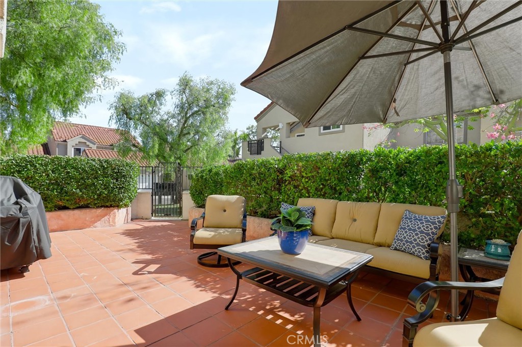 Expansive back patio with lush greenery for extra privacy - 27938 Carrington, Mission Viejo CA 92692 - photo 24