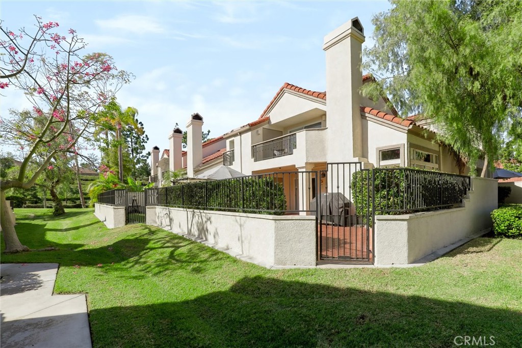 Gated patio overlooking lush landscaping - 27938 Carrington, Mission Viejo CA 92692 - photo 30