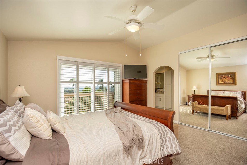 Primary bedroom with mirrored closets and en suite - 28152 Amable, Mission Viejo CA 92692 - photo 17