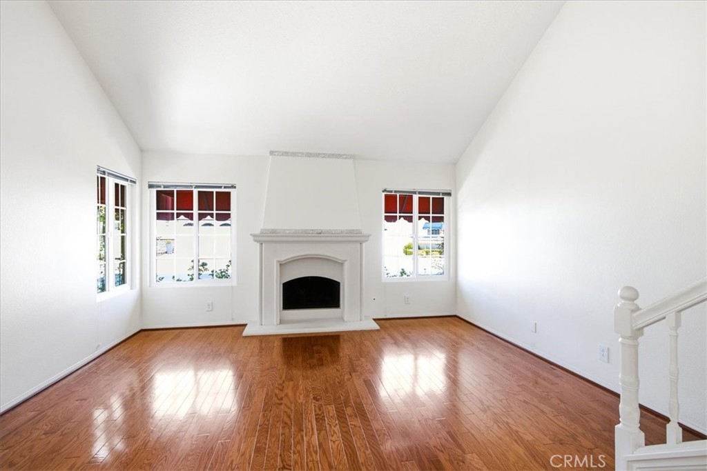 Bright and spacious living room featuring large windows that invite abundant natural light, highlighting the open floor - 28391 Borgona, Mission Viejo CA 92692 - photo 4