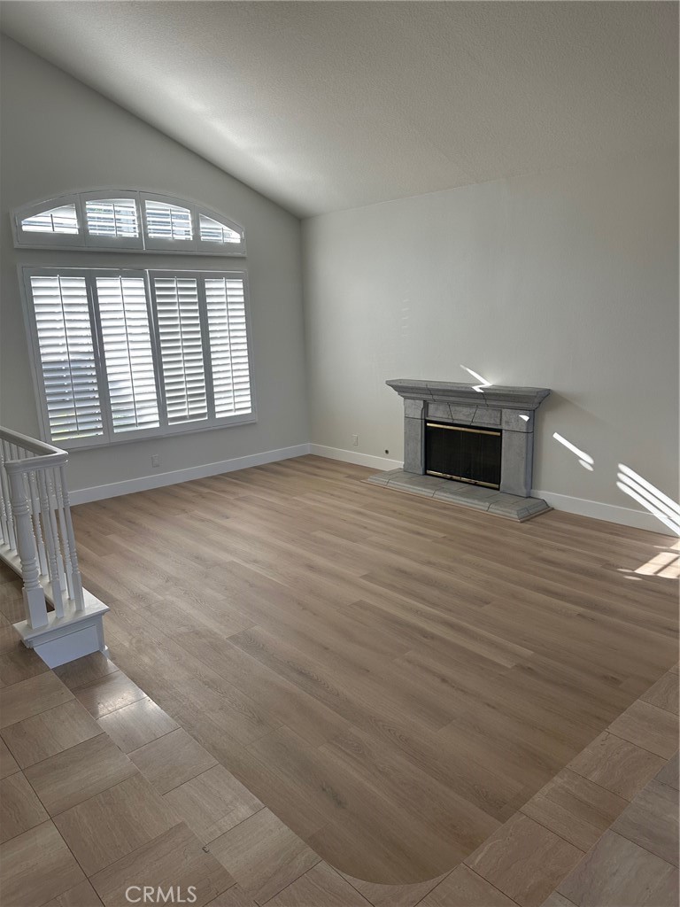 Spacious light and bright living room with fireplace and high ceilings - 28451 Fieldbrook, Mission Viejo CA 92692 - photo 2