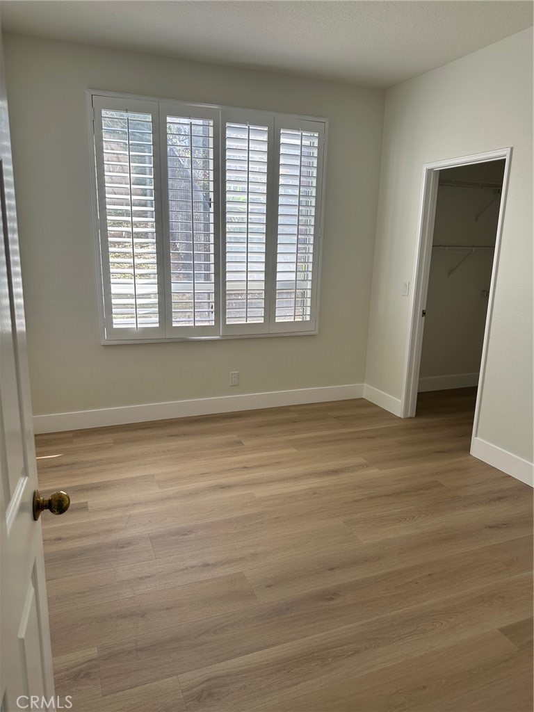 Main floor bedroom #5 with walk-in closet - 28451 Fieldbrook, Mission Viejo CA 92692 - photo 15