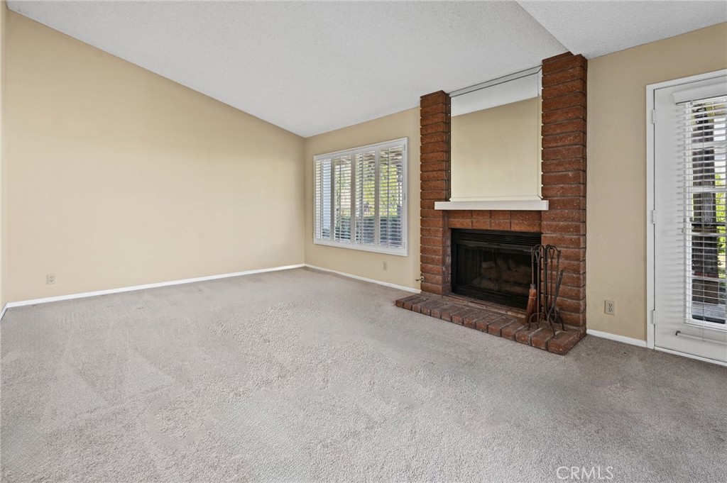 Spacious living room with fireplace - 28546 Cano, Mission Viejo CA 92692 - photo 5