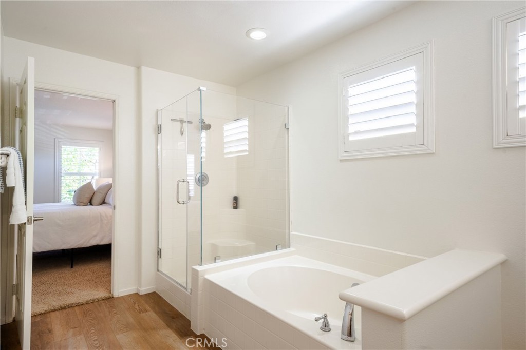 Primary Bathroom #1 En suite. Upgraded Frameless Glass Walk-in Shower and Separate Soaking Tub. - 9 Calle Rosado, Mission Viejo CA 92692 - photo 33