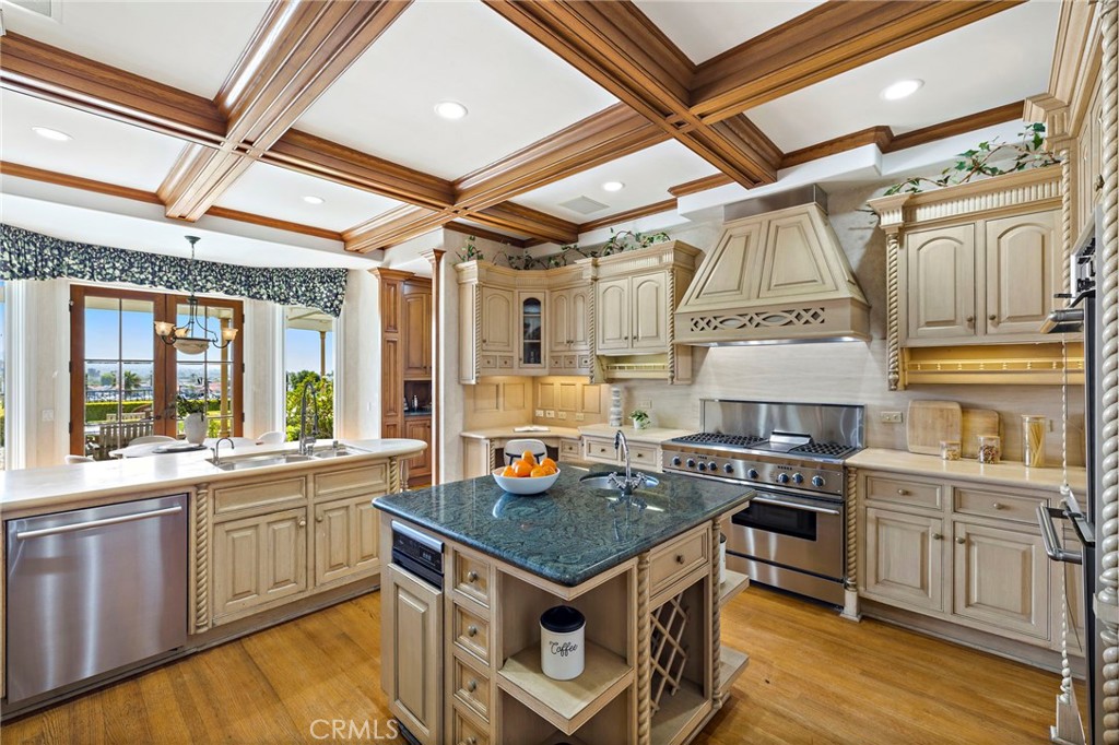 Kitchen showing the island with vegetable sink - 108 Kings Place, Newport Beach CA 92663 - photo 18