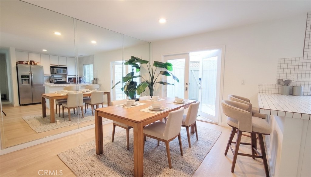 Virtually Staged Dining Room Leading to Outdoor Patio - 11 Northwind Court, Newport Beach CA 92663 - photo 18