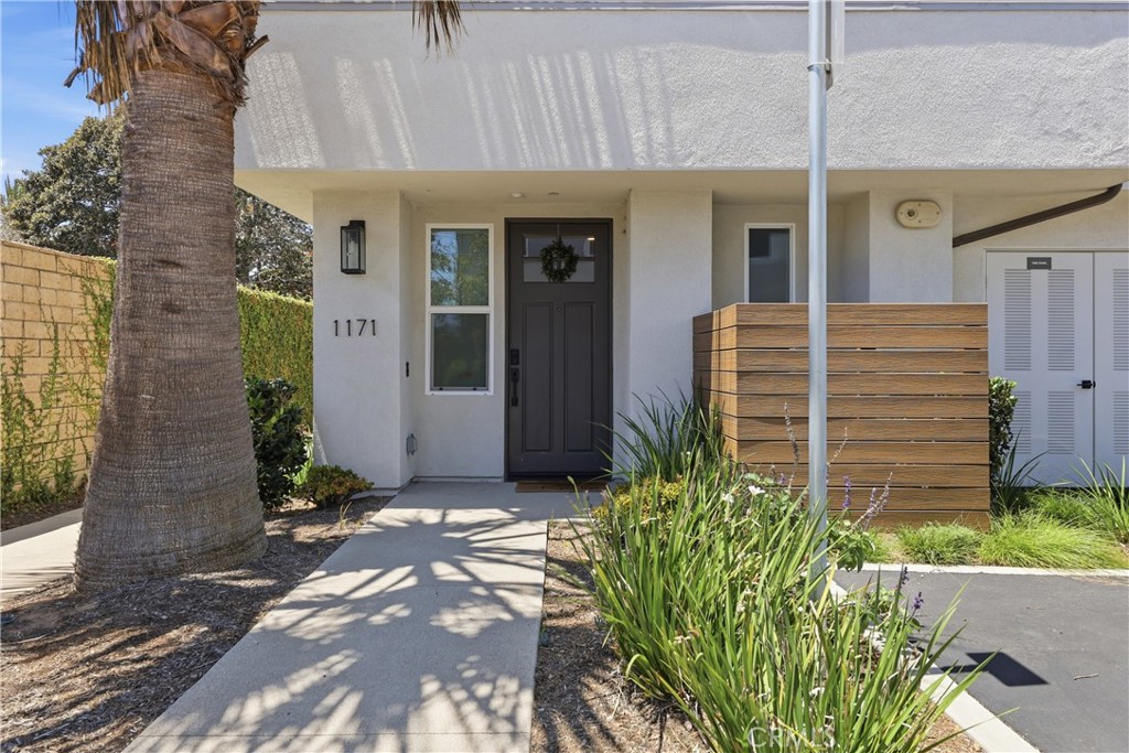 The front door entrance to the unit, which is an end unit! - 1171 Winslow Lane, Newport Beach CA 92660 - photo 2