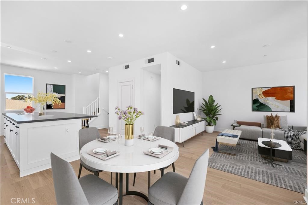 Here is the view looking from the dining area back to the kitchen and the living room. - 1171 Winslow Lane, Newport Beach CA 92660 - photo 6
