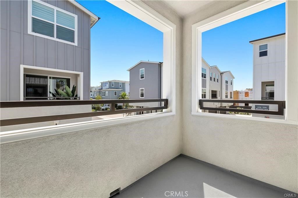 A view of the covered patio off the dining area & kitchen. - 1171 Winslow Lane, Newport Beach CA 92660 - photo 10