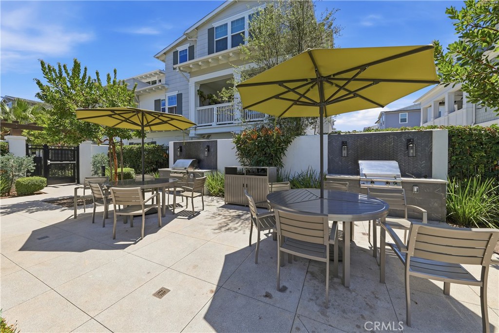 The BBQ and eating area of the gated community area. - 1171 Winslow Lane, Newport Beach CA 92660 - photo 18