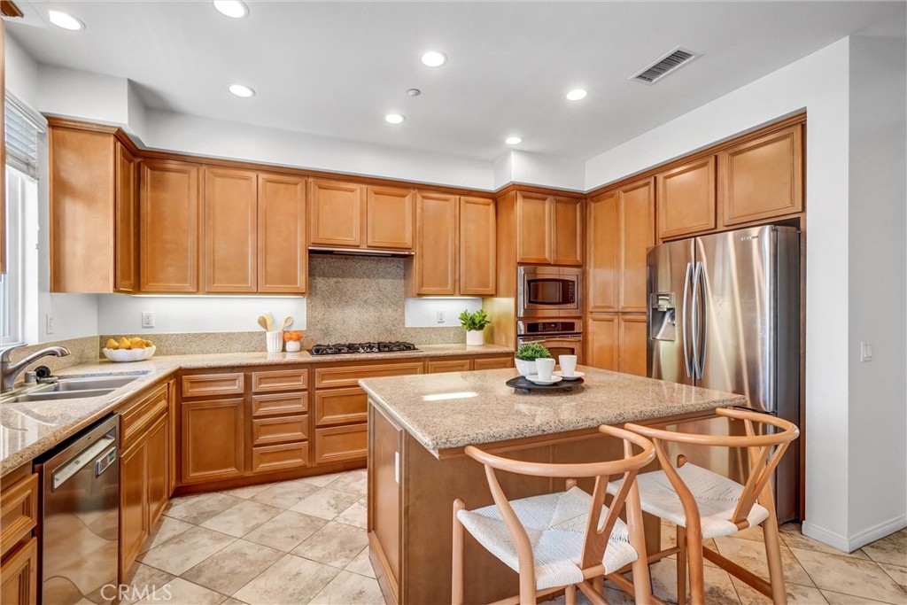 Lots of Cabinets and Center Island with Granite Counters. Refrigerator included - 12 Shellprint Court, Newport Beach CA 92663 - photo 15