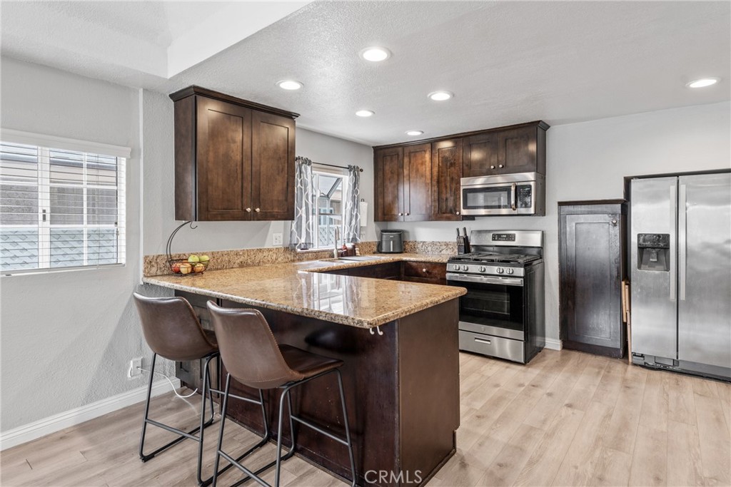 Kitchen with modern appliances - 126 E Balboa, Newport Beach CA 92661 - photo 10