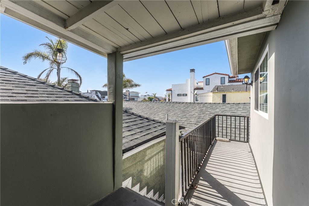 Balcony with a peekaboo view of the water - 126 E Balboa, Newport Beach CA 92661 - photo 31