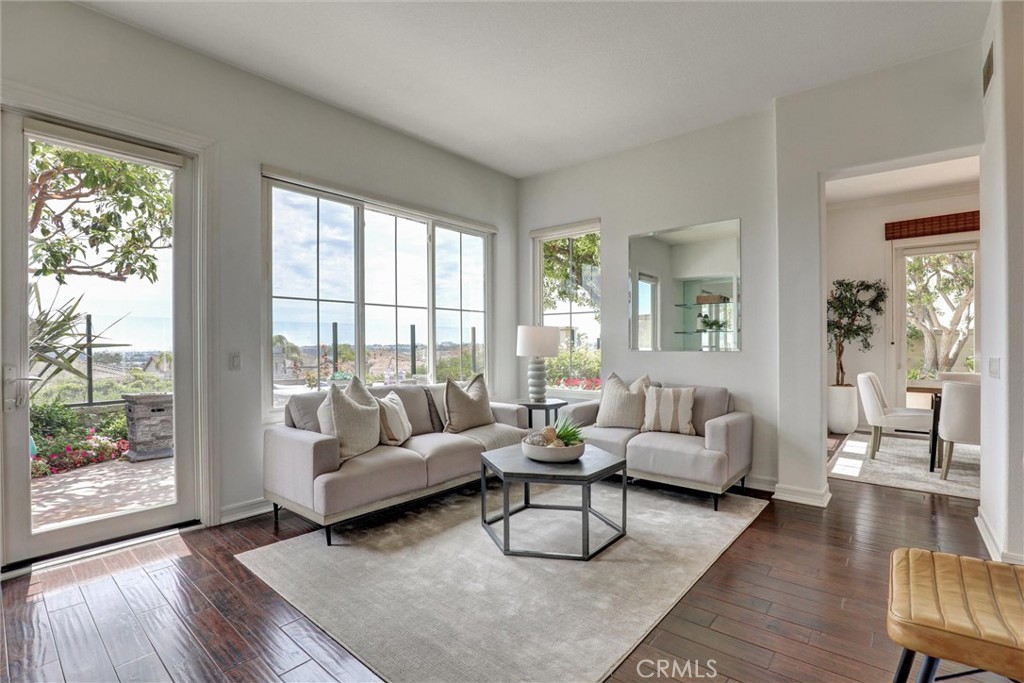 The family room seamlessly connects to the kitchen and views beyond. - 1402 Sea Ridge Drive, Newport Beach CA 92660 - photo 5