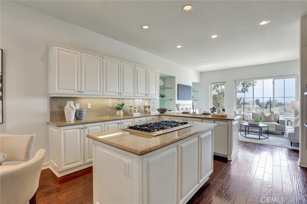 A spacious kitchen at the heart of the home. - 1402 Sea Ridge Drive, Newport Beach CA 92660 - photo 7