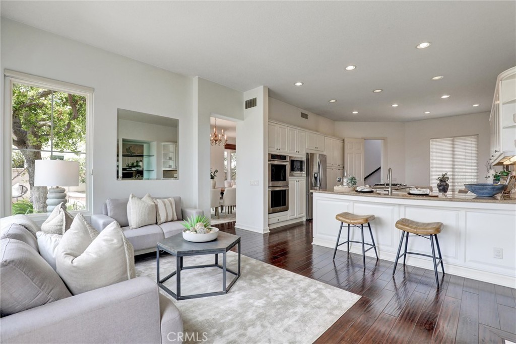 Designed for gathering, the family room and kitchen create the heart of the home. - 1402 Sea Ridge Drive, Newport Beach CA 92660 - photo 11