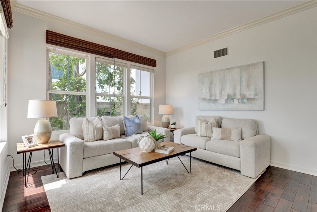 The elegant living room offers a warm and inviting space to relax or entertain. - 1402 Sea Ridge Drive, Newport Beach CA 92660 - photo 15