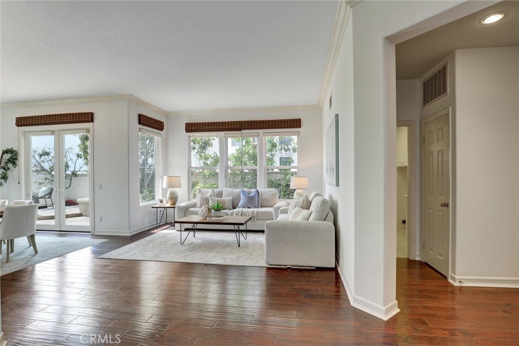 The living room opens naturally to the dining area, making everyday living and entertaining effortless. - 1402 Sea Ridge Drive, Newport Beach CA 92660 - photo 16