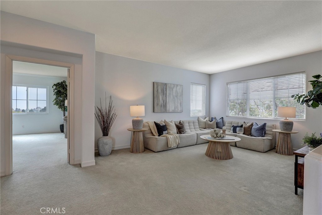 The spacious upstairs loft provides a versatile living area ideal for a family room, home office, or media space. - 1402 Sea Ridge Drive, Newport Beach CA 92660 - photo 17