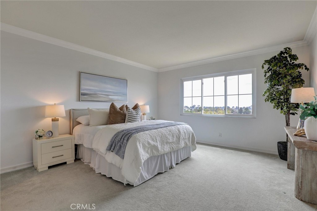 Designed for comfort and privacy, the primary suite includes a spacious walk-in closet and an ensuite bathroom. - 1402 Sea Ridge Drive, Newport Beach CA 92660 - photo 22