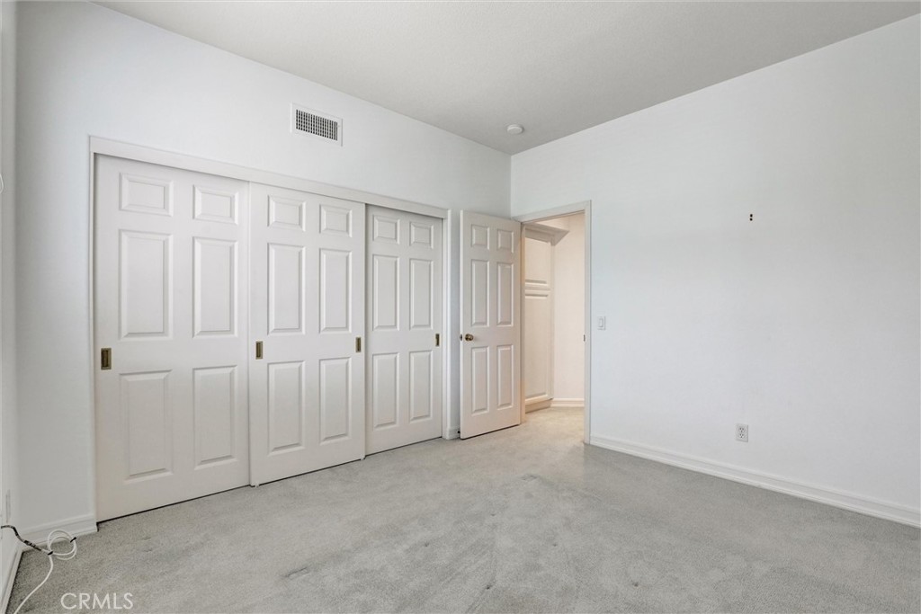 A well-proportioned secondary bedroom offers flexibility for family, guests, or a home office. - 1402 Sea Ridge Drive, Newport Beach CA 92660 - photo 29