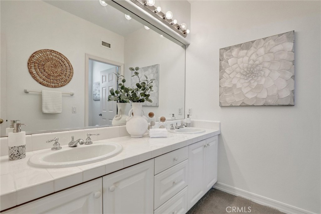 Dual vanities and generous counter space enhance the spacious secondary bathroom. - 1402 Sea Ridge Drive, Newport Beach CA 92660 - photo 30