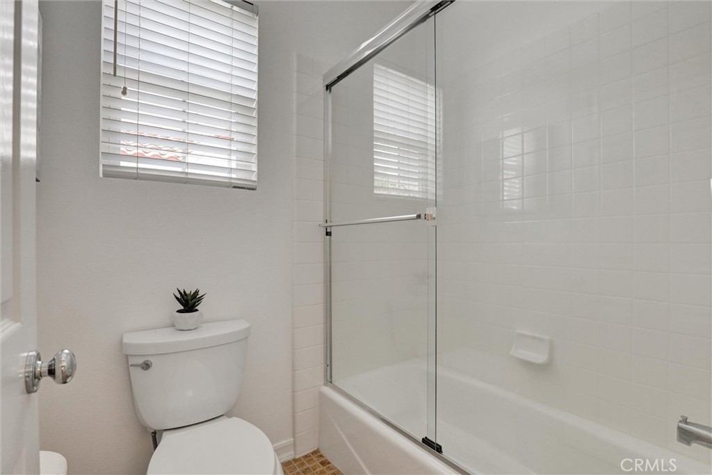 The secondary bathroom offers the convenience of both a shower and bathtub, providing flexibility for family members and - 1402 Sea Ridge Drive, Newport Beach CA 92660 - photo 31