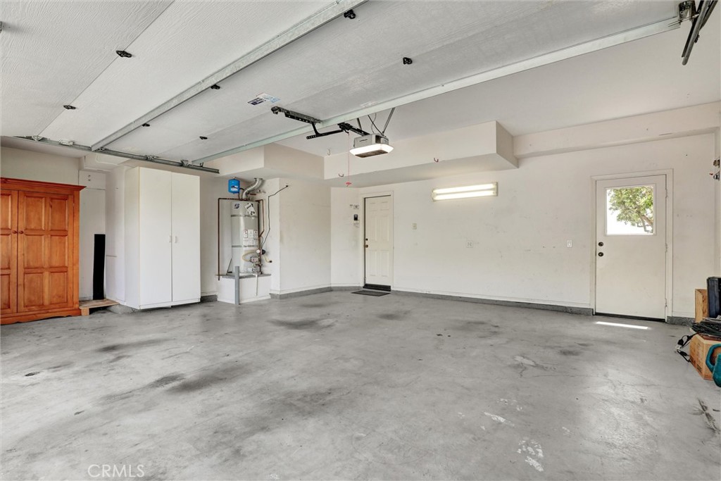 The attached two-car garage combines generous space with convenient direct access into the home. - 1402 Sea Ridge Drive, Newport Beach CA 92660 - photo 36