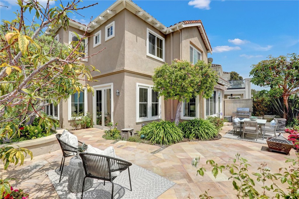 The expansive backyard patio offers multiple areas for relaxing and entertaining while enjoying beautiful views of the U - 1402 Sea Ridge Drive, Newport Beach CA 92660 - photo 38