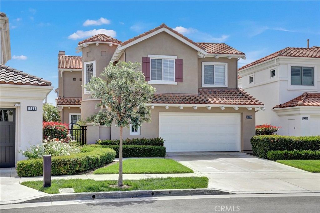 A distinctive front elevation showcases timeless coastal architecture with a charming turret, manicured landscaping, and - 1402 Sea Ridge Drive, Newport Beach CA 92660 - photo 40